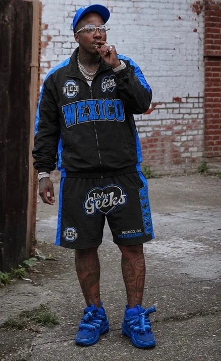 Poochie MrPrince in a blue and black Wexico I Heart My Geeks tracksuit